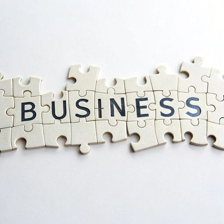 Puzzle pieces with word business. Business and finance concept image.の素材