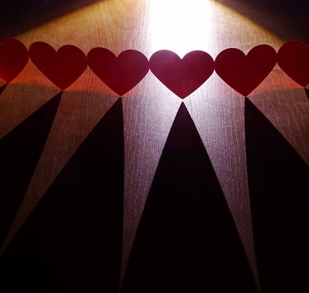 Group of red hearts connected in chainの写真素材