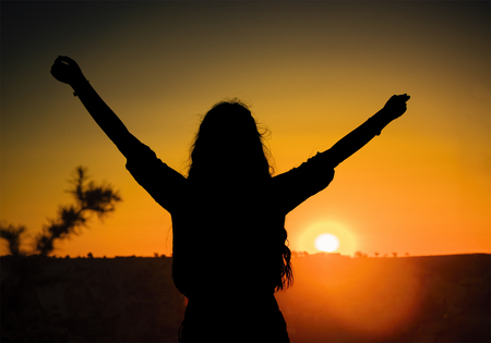 the happy young girl at sunset.long live the holidays