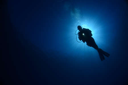 Underwater modeling. Reserve light, blue background.の写真素材