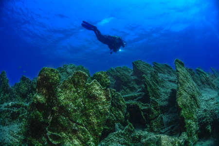 Underwater modeling. Reserve light, blue background.の写真素材