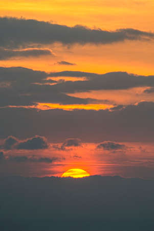 The disappearance of the sun between the clouds. sunset.