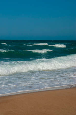 pebbly seascape, background blue clouds. Pruva Beach, Istanbul.の写真素材