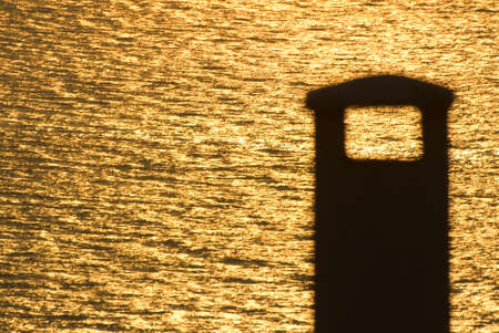 Sunset and lighthouse. pear lantern Lighthouse view at sunset. Armutlu, Yalova, Turkey.の写真素材