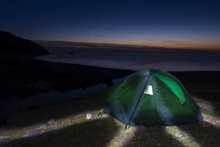 Set up a tent by the sea. Camping by the sea. Gokceada, Canakkale, Turkey.の写真素材