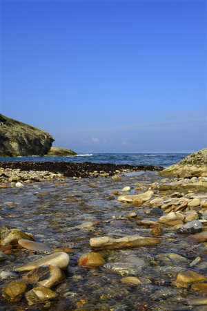 Rocks in the sea. seascape, sea waves crashing against the rocks. The sea wave crashes against the...