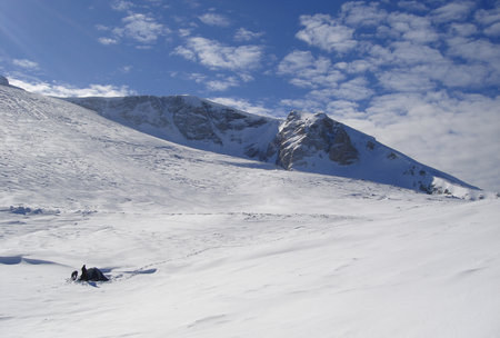 snow floor, snow texture, snowy peaks in cold sunny weather, cloudy snow landscape. Windblown snow texture. Uludag, National Park, Bursa Turkey.の写真素材