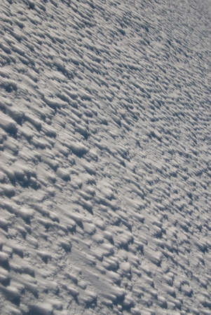 snow floor, snow texture, snowy peaks in cold sunny weather, cloudy snow landscape. Windblown snow texture.Uludag, National Park, Bursa Turkey.の写真素材