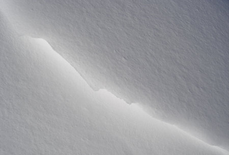 snow floor, snow texture, snowy peaks in cold sunny weather, cloudy snow landscape. Windblown snow texture. Uludag, National Park, Bursa Turkey.の写真素材