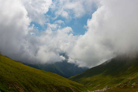 Mountain adored with clouds. Hill surrounded by clouds. Mountain lost in fog. Kackar Mountains. Rize, Turkey.の写真素材