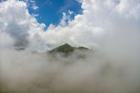 Mountain adored with clouds. Hill surrounded by clouds. Mountain lost in fog. Kackar Mountains. Rize, Turkey.の写真素材