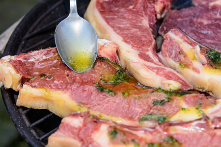 Fresh meat before it is roasted on the barbecue.
Condiment: olive oil, parsley. Sauce: olive oil, salt, parsley.の写真素材