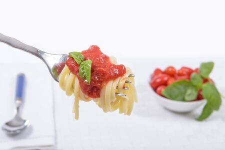 Spaghetti on fork with Tomato Italian Sauceの写真素材