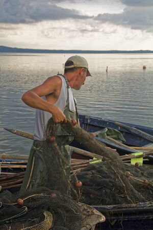 Sunset in the lagoon, where fishermen return to the approach of the impending storm. Dawning....