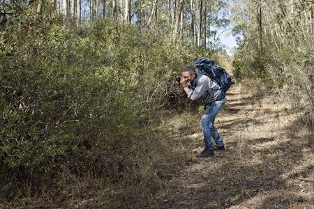 Hiker in the Sardinian Forest with mirrorless camera