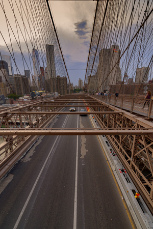 New York City, USA - June 08, 2015: Traffic including a New York Taxi crosses the bridge from Downtown Manhattan in the background toward Brooklyn.のeditorial素材