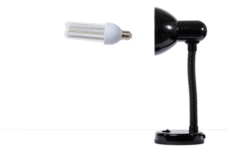 Led lamp in off position with black lamp holder. White backgroundの写真素材