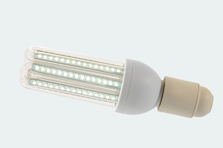 Led lamp in on position with  glass bulb and E27 socket. White background.の写真素材