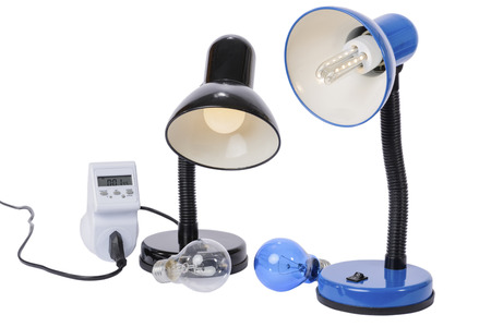 Led lamp illuminated with lampholder replaces the old obsolete light bulbs. An energy meter calculates the savings of electrical energy.の写真素材