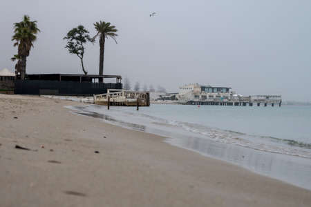 Beach scene banner and dream homes in the mist at dawn in the calm sea with tranquility and peace.の写真素材