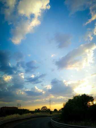 Beautiful sunset over country roadの写真素材