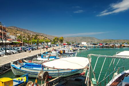 Elounda, Greece, Crete - 05/24/2015: Ships and fishing boats in the harbor of Elounda.のeditorial素材