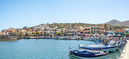 Elounda, Greece, Crete - 05/24/2015: Ships and fishing boats in the harbor of Elounda.のeditorial素材