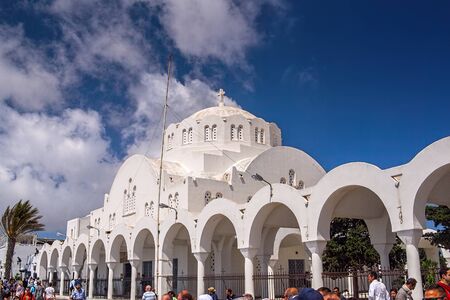 Thira, Greece - 05/20/2015: Cathedral Church Of Candlemas Of the Lord in the famous touristic tour of Fira town at summer sunny day.Santorini (Thira)のeditorial素材