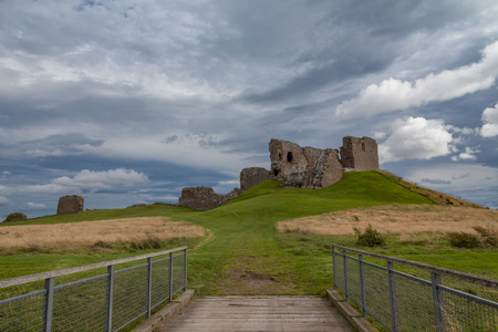 Duffus castle on top of a hill with roadの写真素材