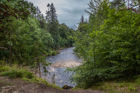 Findhorn river flowing through Highlandsの写真素材