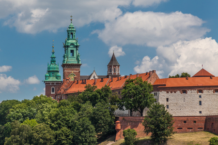 a view of fortification ion complex of Wawel Krakow with blue sky and river Wisla on the foregroundのeditorial素材