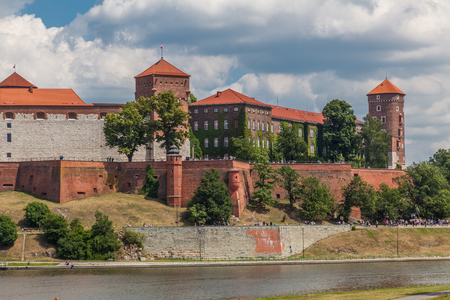 a view of fortification ion complex of Wawel Krakow with blue sky and river Wisla on the foregroundのeditorial素材