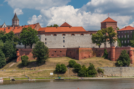 a view of fortification ion complex of Wawel Krakow with blue sky and river Wisla on the foregroundのeditorial素材