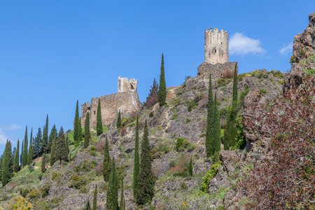 Lastrous castle in France on top of the mountain on a sunny day with trees and pathのeditorial素材