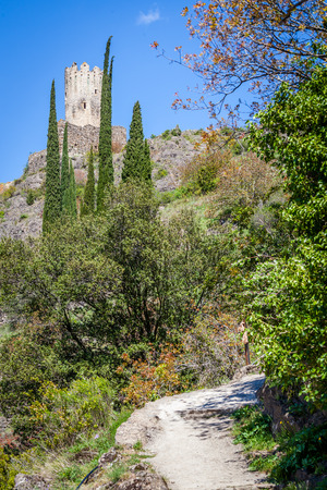 Lastrous castle in France on top of the mountain on a sunny day with trees and pathのeditorial素材