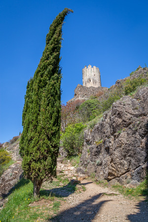 Lastrous castle in France on top of the mountain on a sunny day with trees and pathのeditorial素材