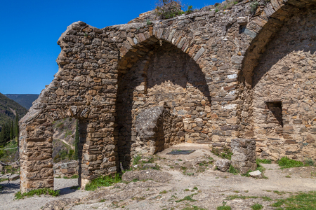 a stone entry of ruins Lastrous castle in South of France on a sunny dayの写真素材