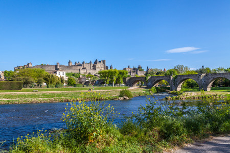 La Cite and Pont Vieux crossing the Aude river in Carcassoneの写真素材