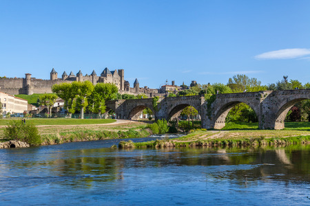 La Cite and Pont Vieux crossing the Aude river in Carcassoneの写真素材