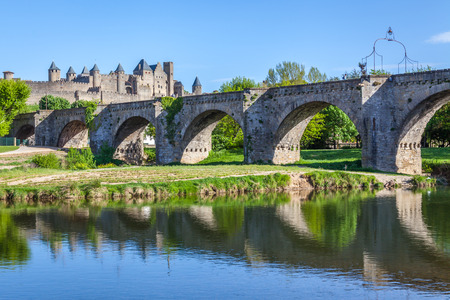 La Cite and Pont Vieux crossing the Aude river in Carcassoneの写真素材