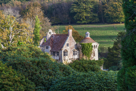 a view of Old Scotney Castle surrounded by trees turning into autumn coloursのeditorial素材