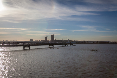 a view of river Thames during the sunset on a sunny day in industrial part of Thames estuary near Rainham naturre reserveの写真素材