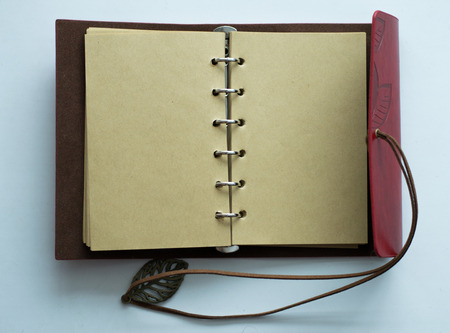 Top view image of open notebook with blank pages nextの写真素材