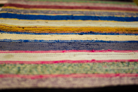 Colored striped traditional color carpet in homeの写真素材