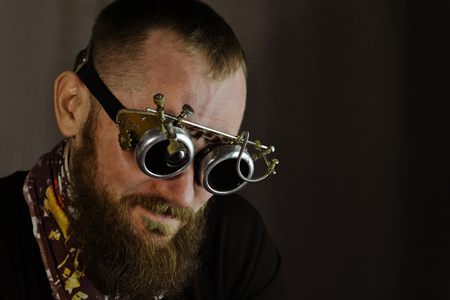 Portret of man in googles in steampunk outfitの写真素材