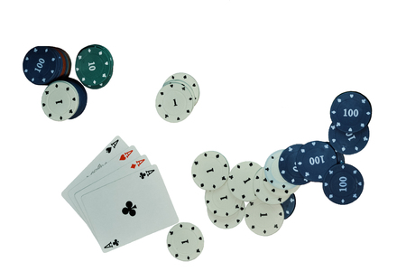 Cards and poker chips isolated on a white background