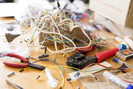 Different electrical wires and other tools on the desktop for working with electronics