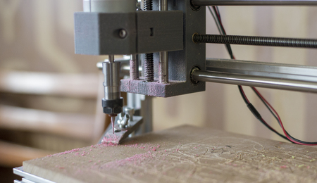 Work of the CNC machine tool on the wooden surface