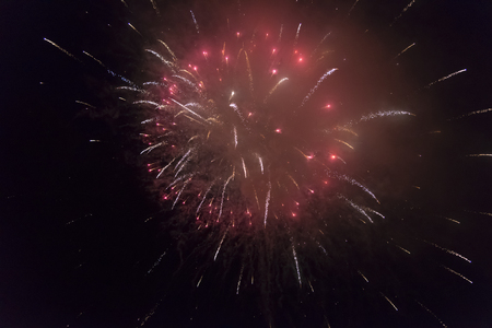 Bright colorful salute in the dark sky on a holidayの写真素材