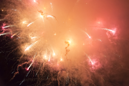 Bright colorful salute in the dark sky on a holidayの写真素材